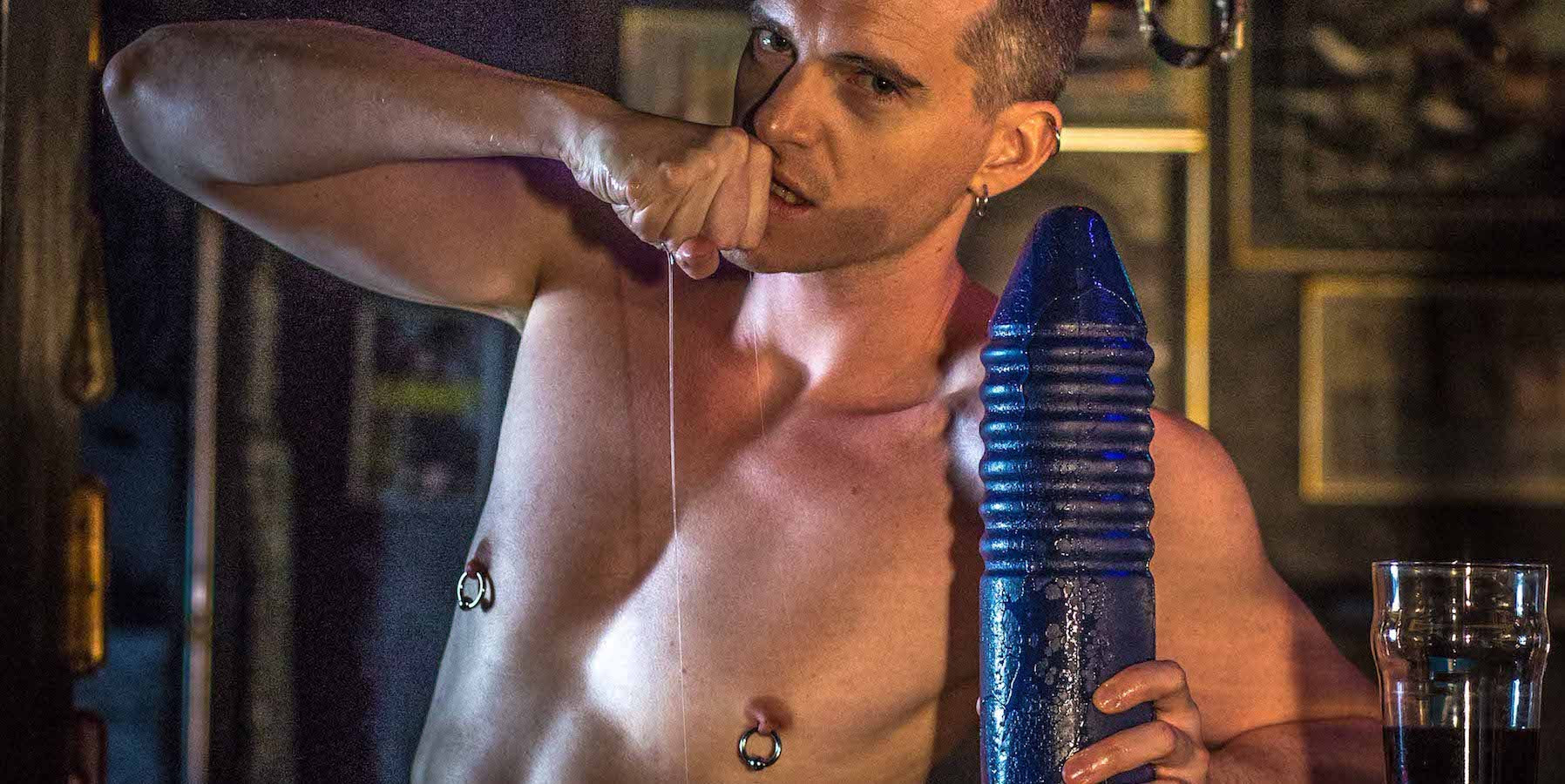 Guy at Bar with a blue dildo