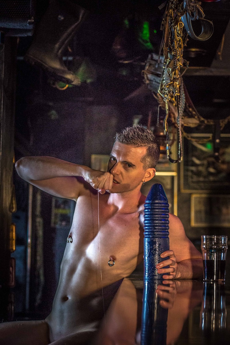 Guy at Bar with a blue dildo